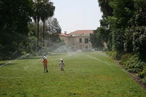 Kids playing in the irrigation spray in Orlando, Florida